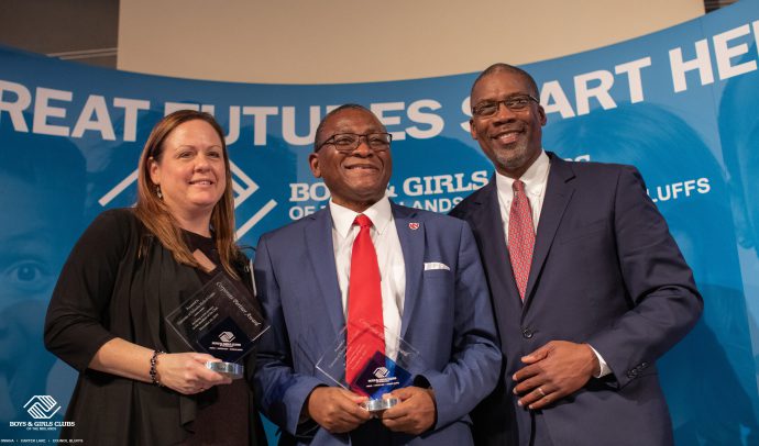 Charity Evans, MD, and Dele Davies, MD (center), received the Corporate Partner Award from the Boys & Girls Club of the Midlands.