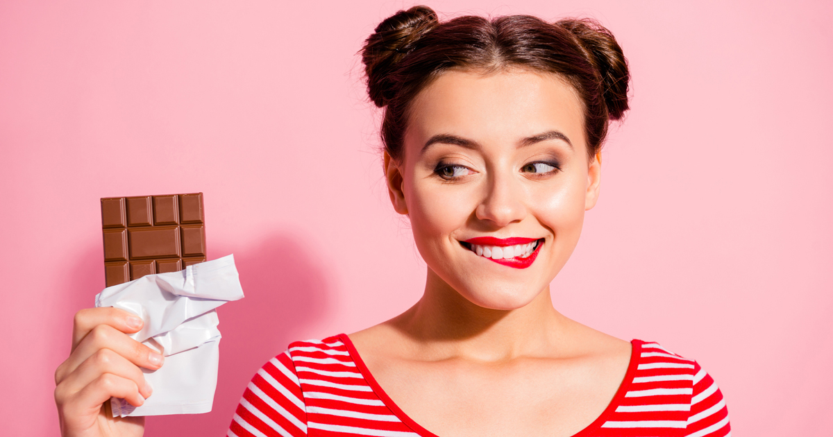 Woman holding chocolate bar