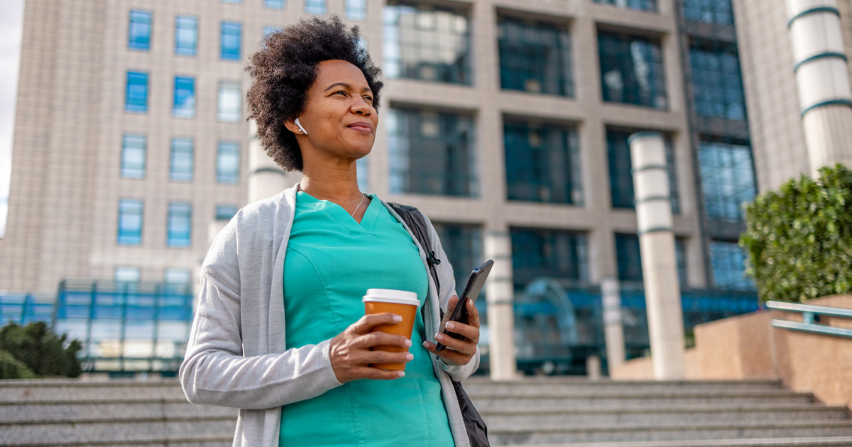 Woman walking with headphones in