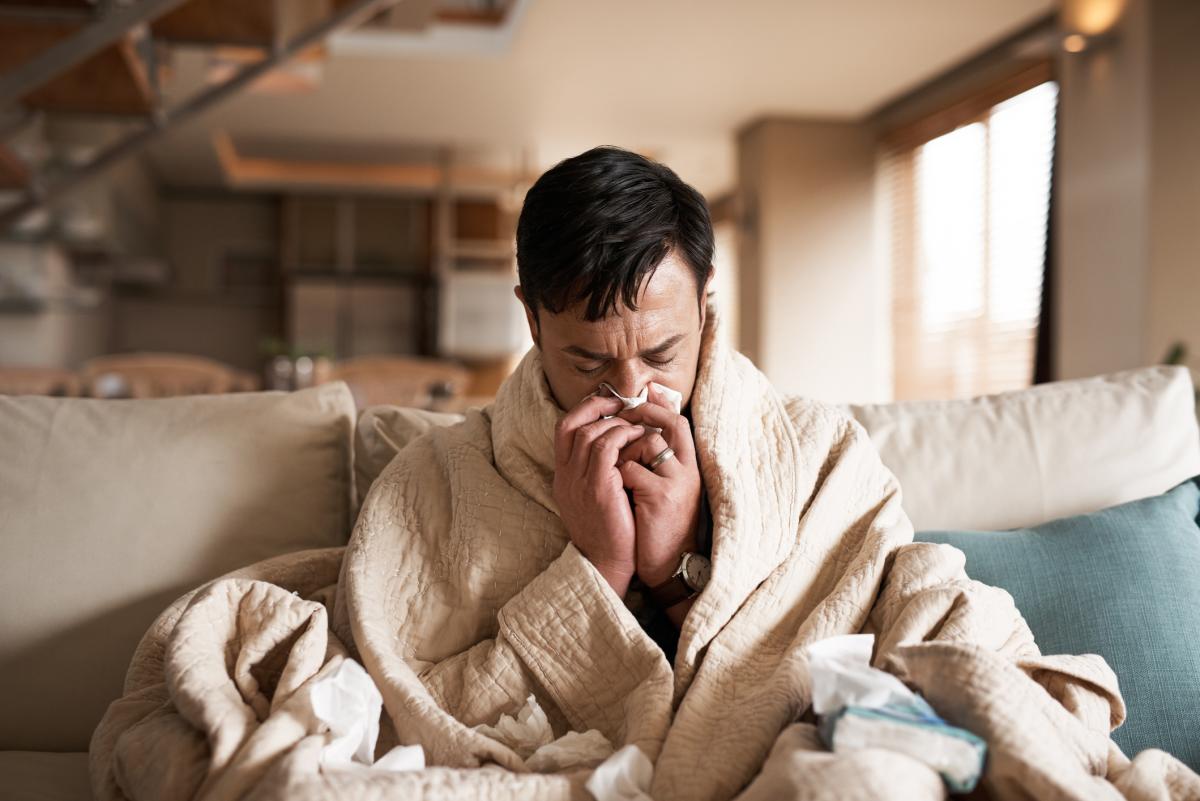 Man blowing his nose