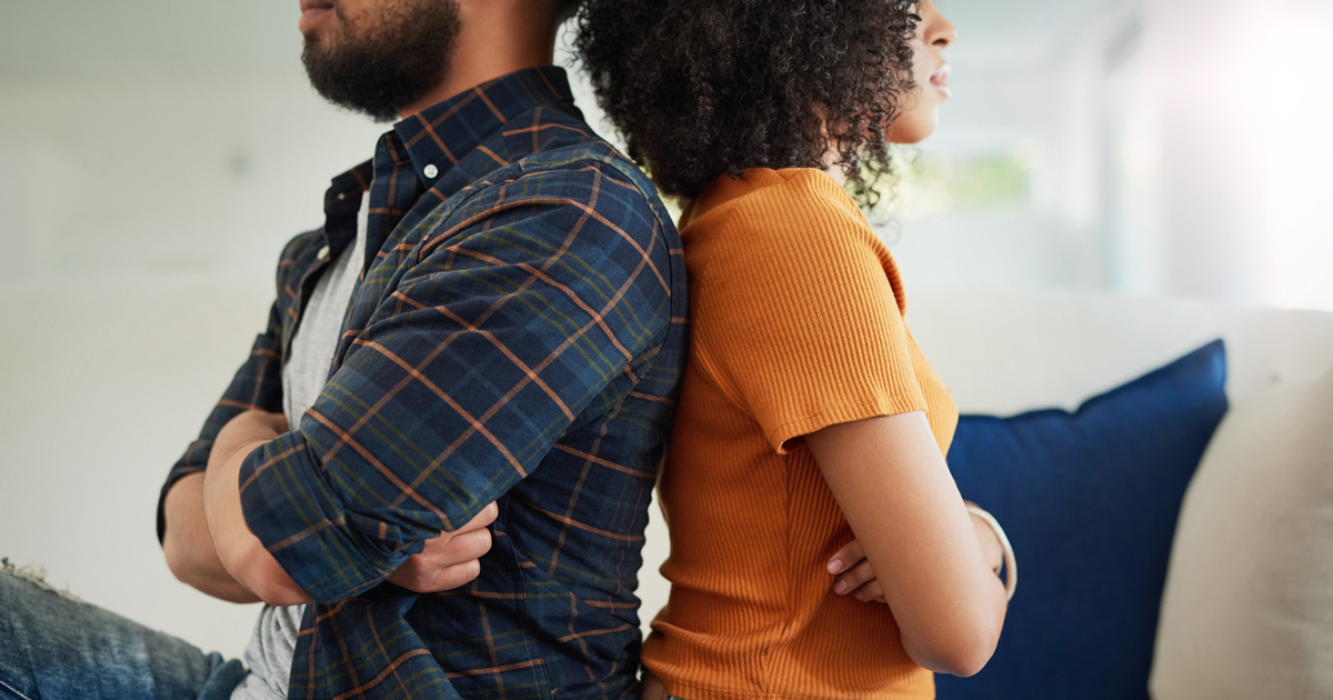 Man and woman sitting back to back