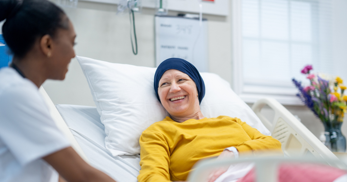 Nurse talking to cancer patient