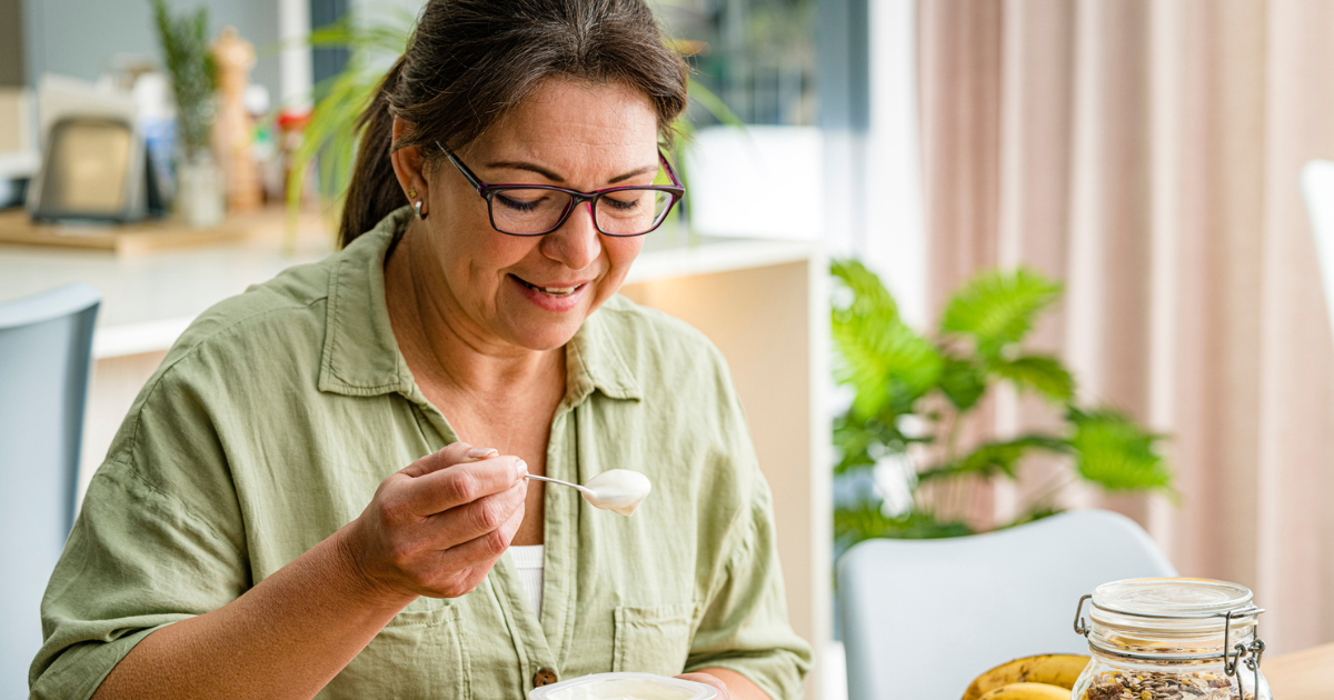 Woman eating yogurt