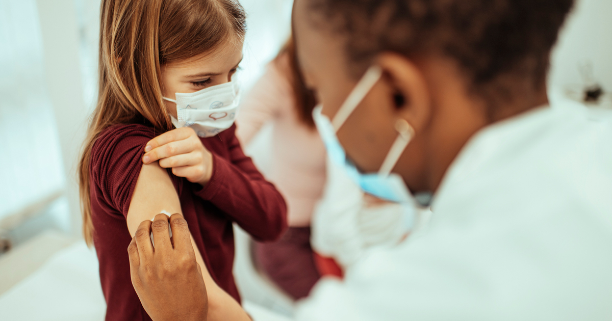 picture of a child getting their COVID-19 vaccine