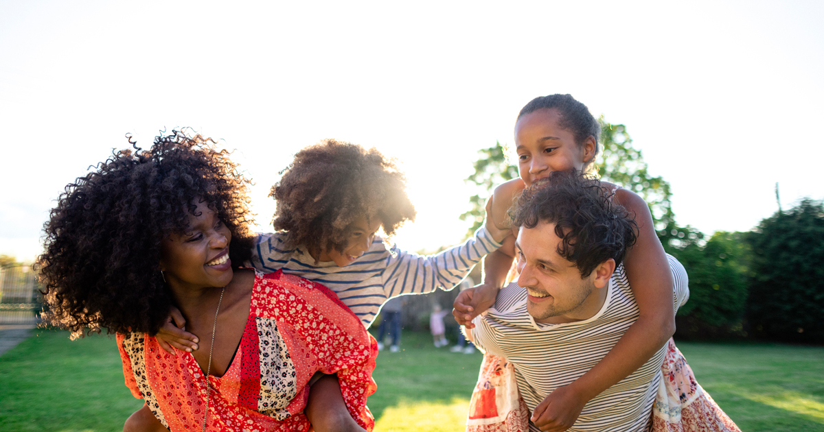 Mother, father, and two young daughters