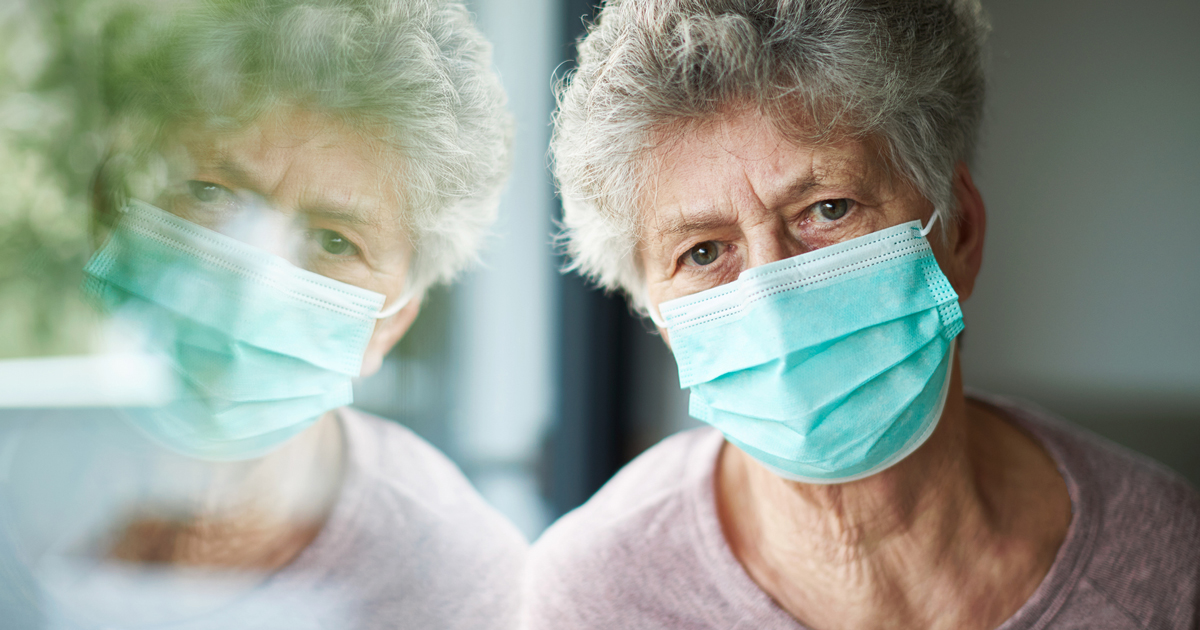 Old woman wearing a mask