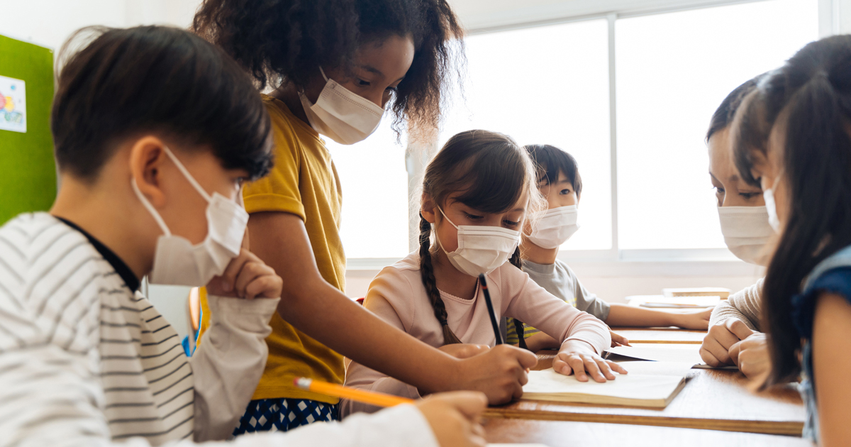 Teacher and students wearing masks