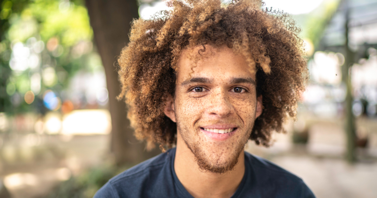 Smiling man with freckles