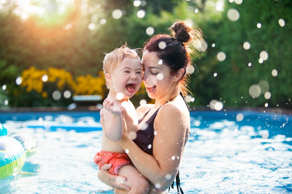 Mother and toddler in a swimming pool.