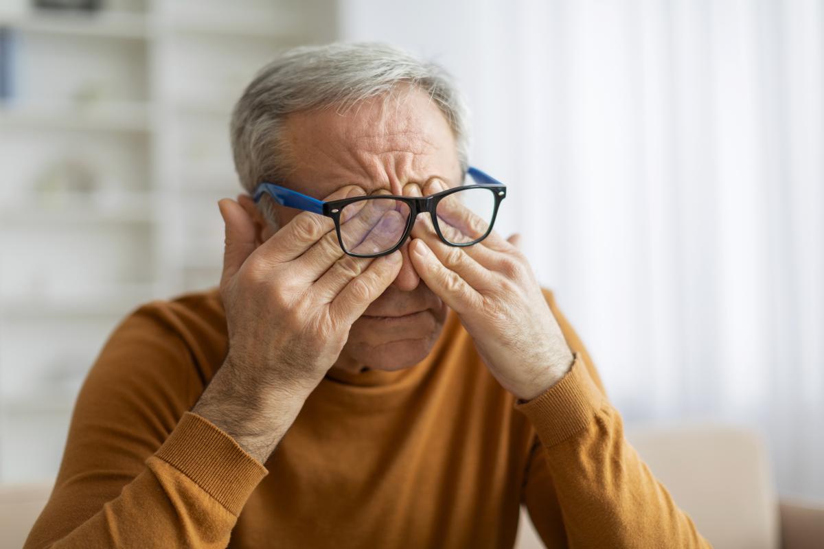 Man rubbing his eyes