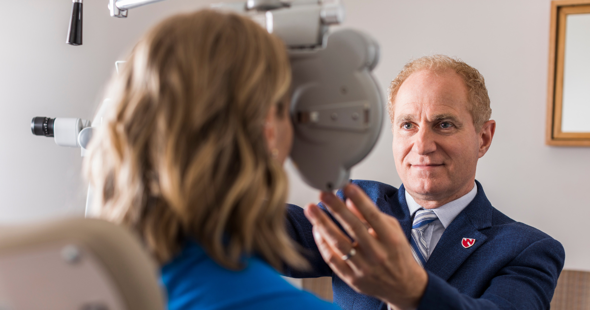 Ronald Krueger, MD, ophthalmologist, with patient