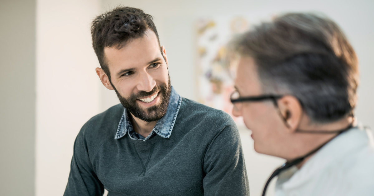 Man talking to doctor