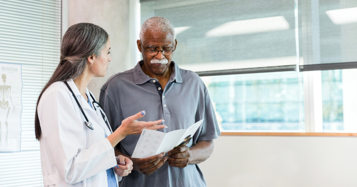 Older man talking to a doctor