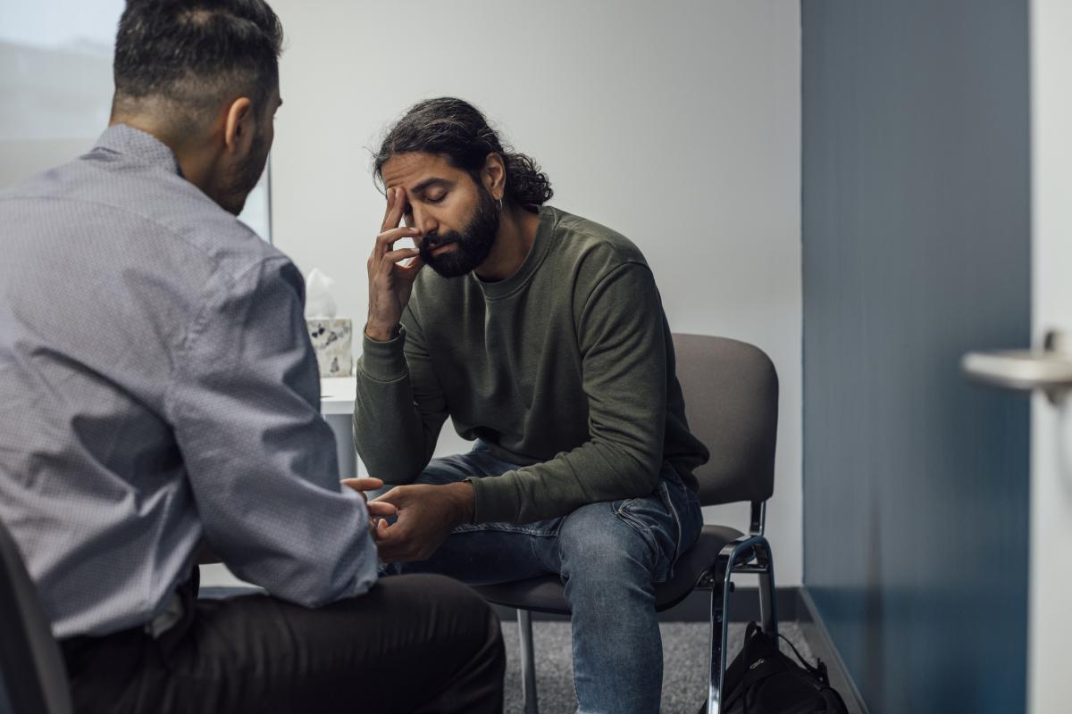 Man talking to doctor