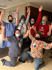 Sayda Woodbury (back row, far left) celebrates with her HBO care team. Pictured are (back row, left to right), Jane Baumann, staff nurse, HBO, Lupe Soria, patient care technician, HBO, Kari Fowler, staff nurse, HBO. (Front row, left to right) Charlie Wehrs and Sandy Olson, both staff nurses, HBO.