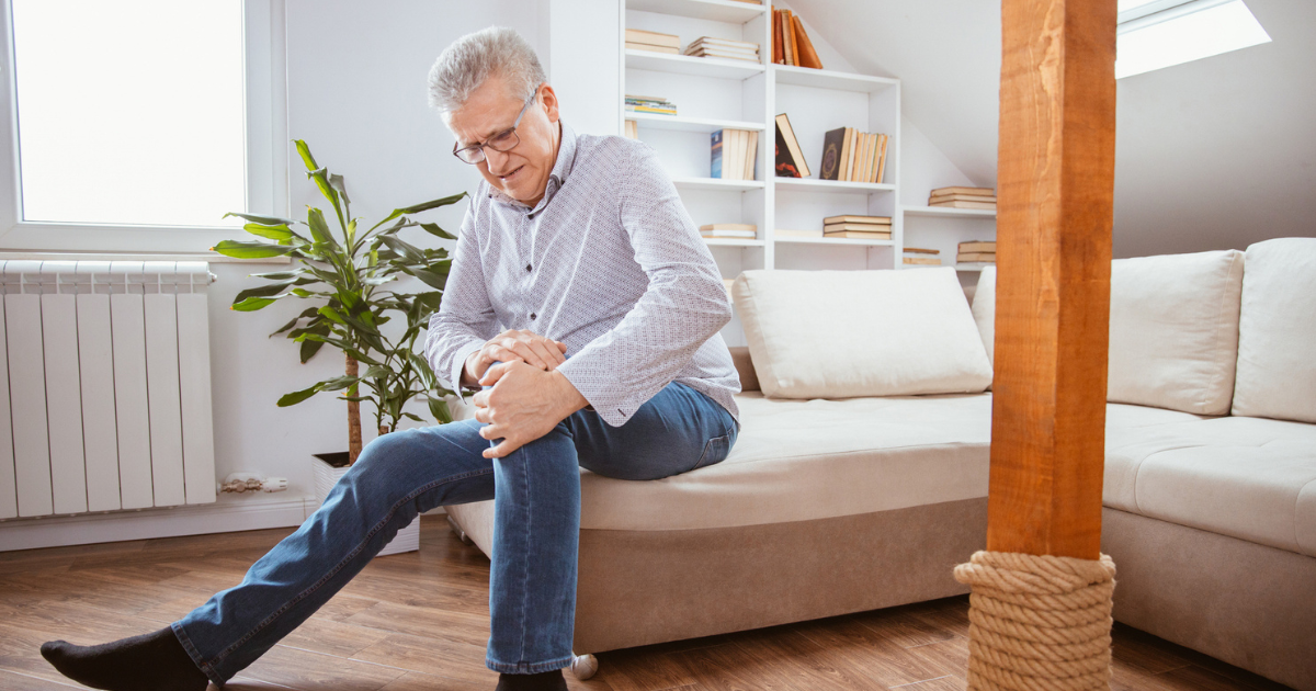 Man holding his knee in pain