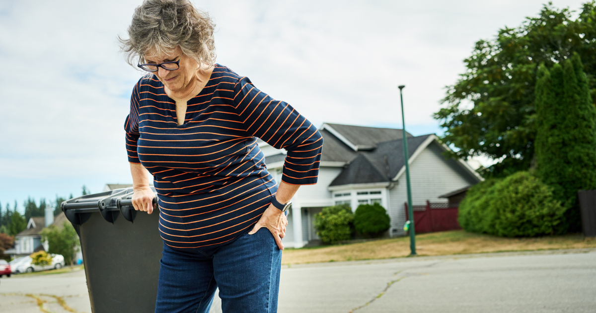 Woman holding her hip in pain