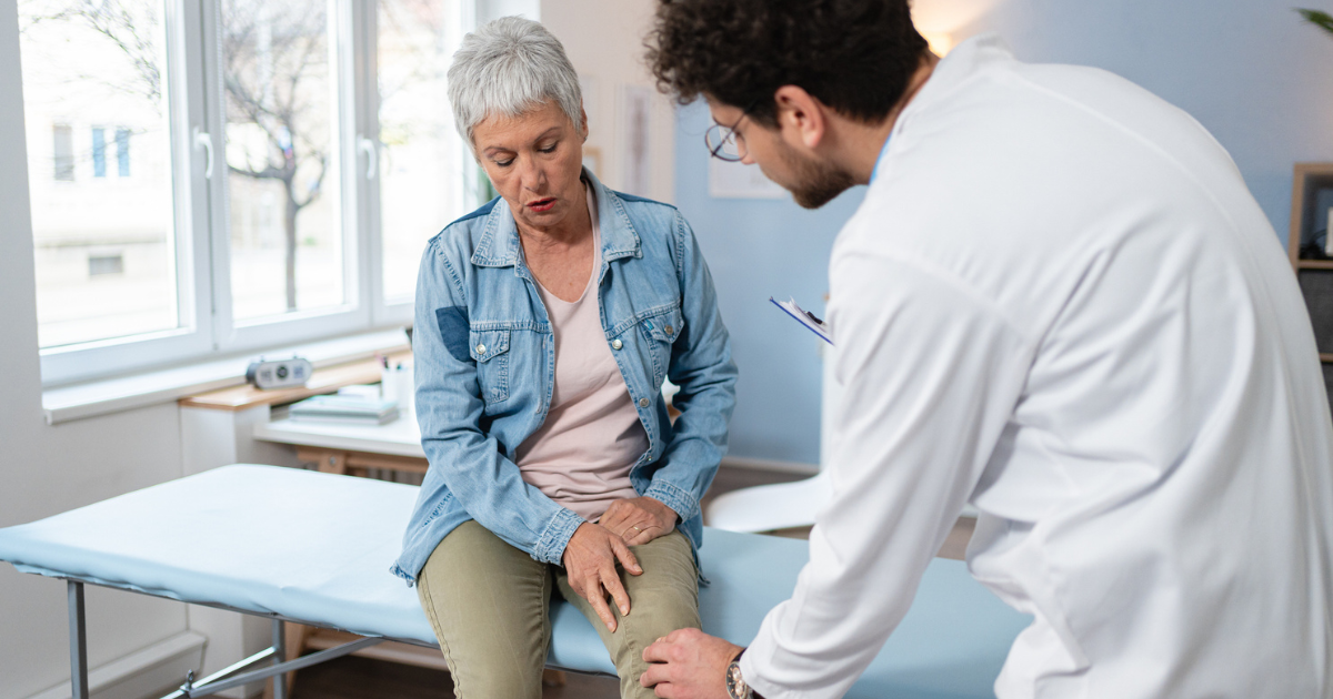 Woman talking to doctor about knee