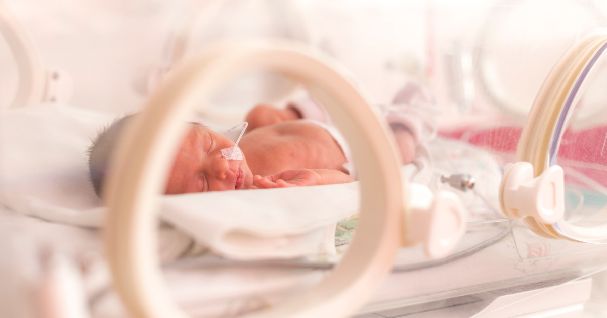 Baby in NICU bassinet