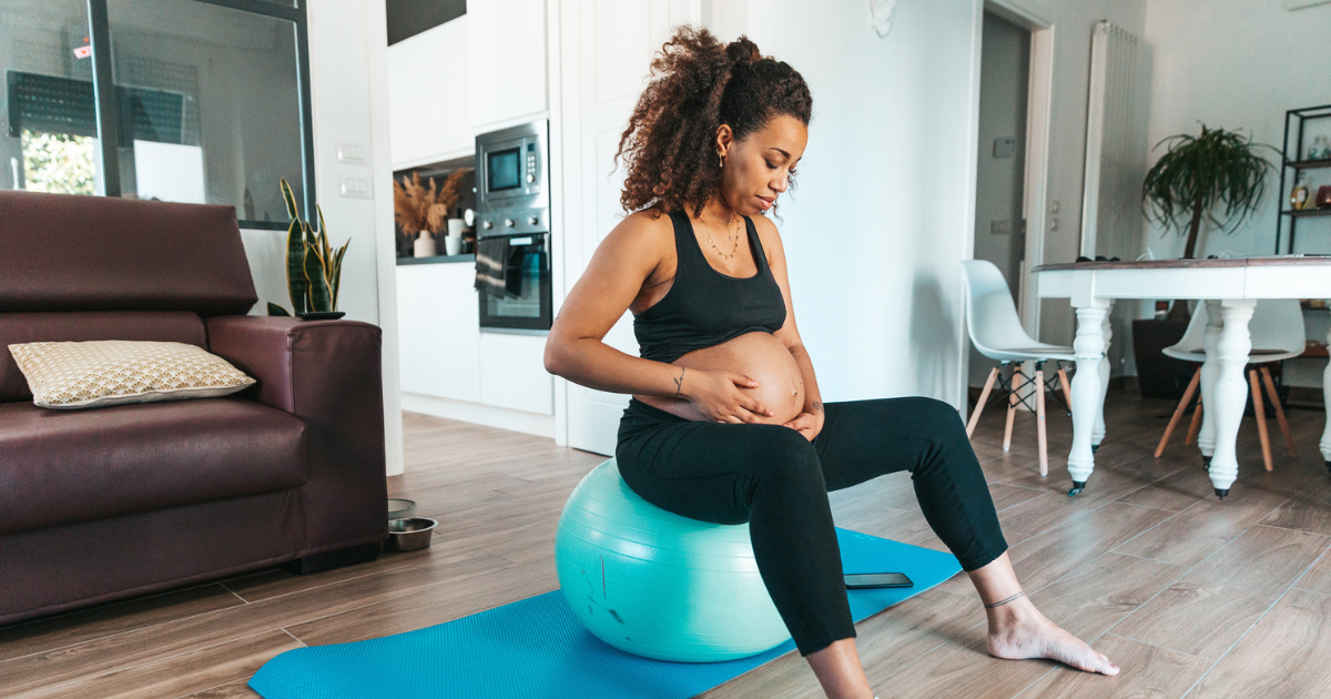 Pregnant woman sitting on an exercise ball