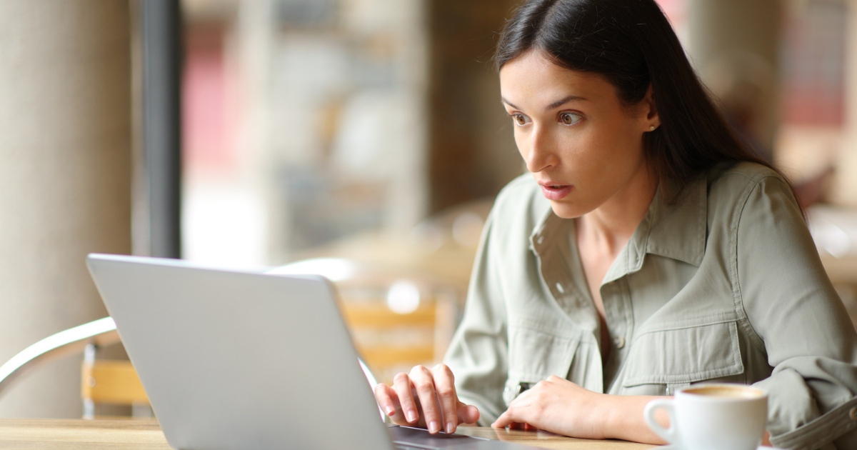 Woman looking at laptop