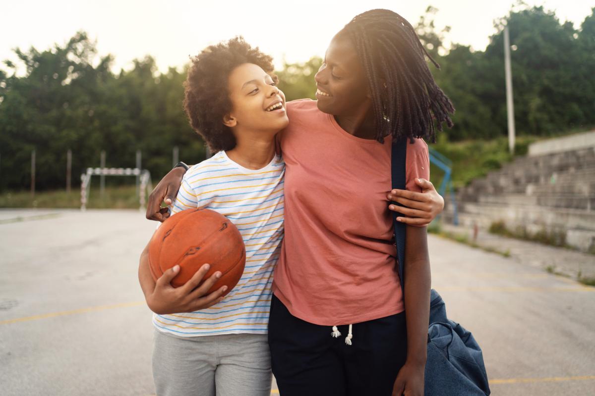 Mom picking up teen daughter from basketball practice