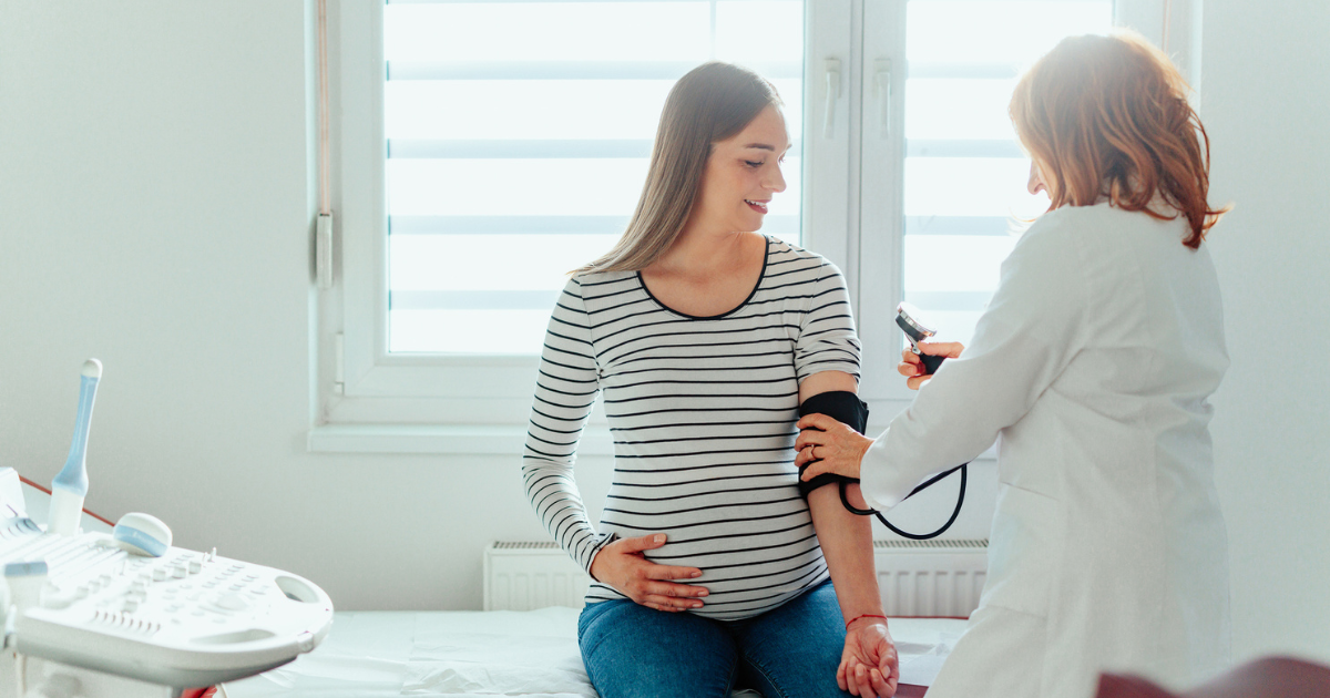 Pregnant woman getting her blood pressure checked