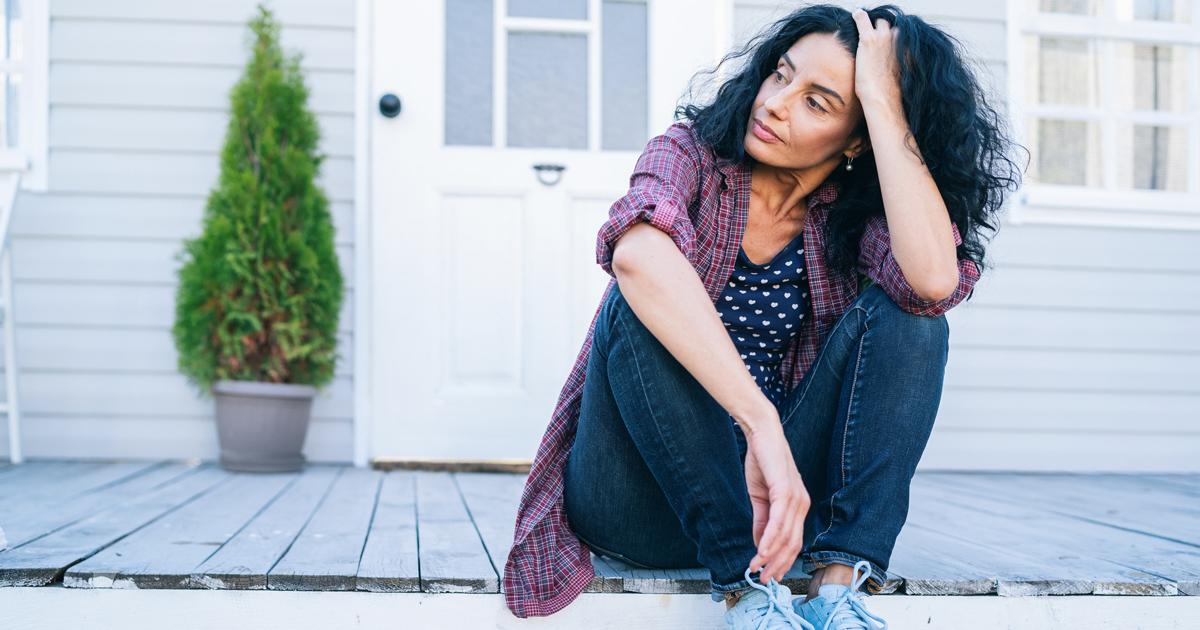 Woman sitting on porch