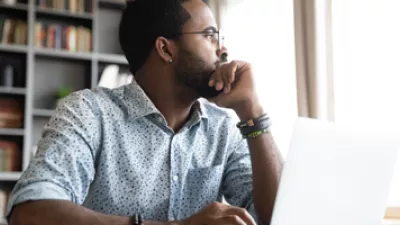 picture of a man looking out a window