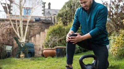 picture of a man clutching his knee