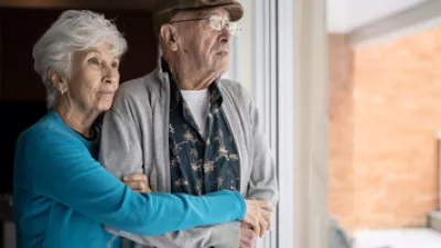 picture of a couple looking out a window