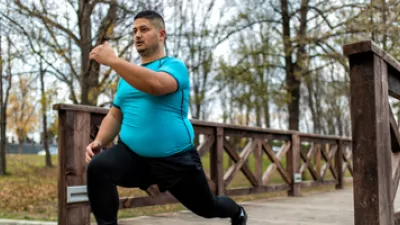 Picture of a man exercising on a bridge