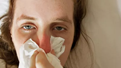 Picture of a woman blowing her nose