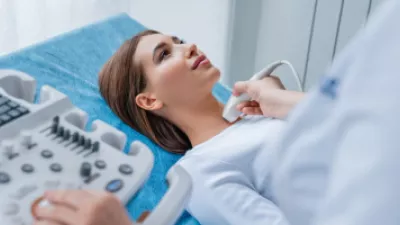 Woman getting ultrasound on her neck