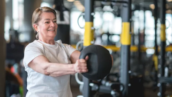 Woman holding medicine ball
