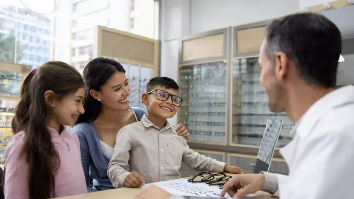 Mother, daughter, and son at eye doctor