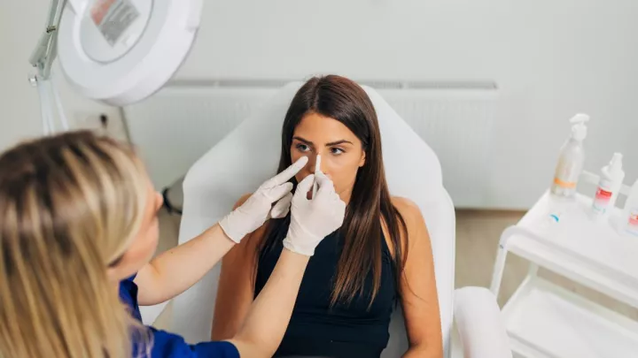 Woman getting nose job consultation