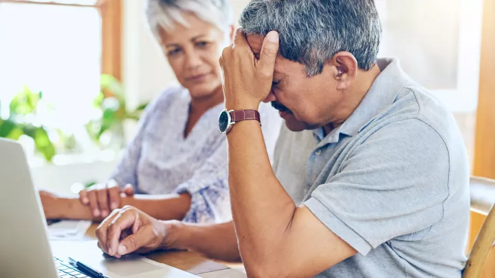 Frustrated couple looking online