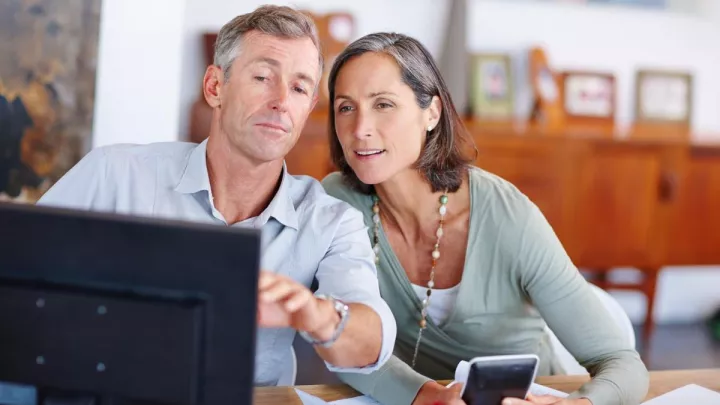 Couple looking at laptop