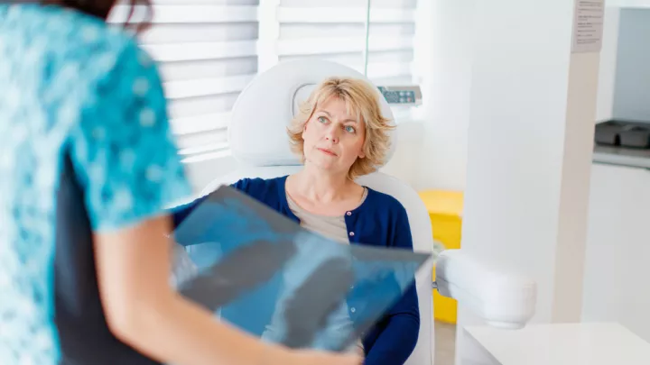 Woman reviewing lung scans with her doctor