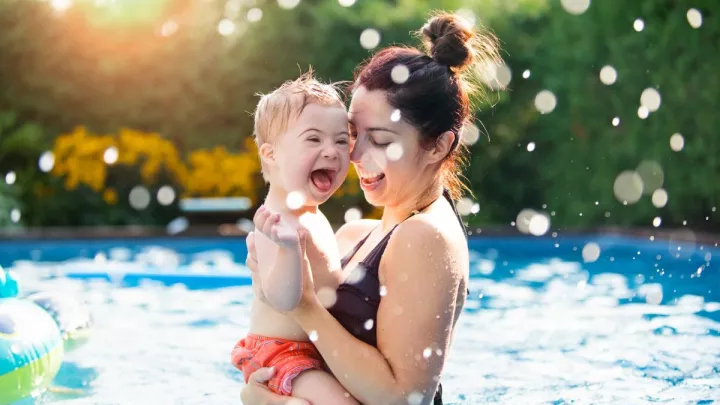 Mother and son in a pool