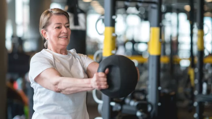 Woman holding medicine ball