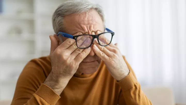Man rubbing his eyes