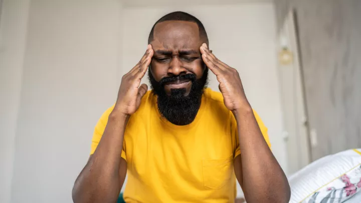 Man holding his head