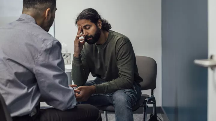 Man talking to doctor