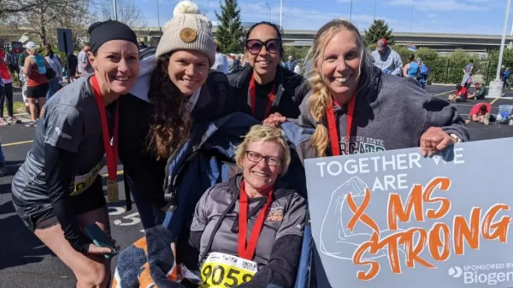 Kim Kozelichki lives with MS and completed the Lincoln Half Marathon in 2022 with support from her care team. Individuals featured left to right: Renee Stewart, APRN, DNP, MAHA Program; Eileen Meslar, friend and supporter of the team; Kristen Bayly, RN, MS At Home Access Program; and Nancy Lenz, PT, with Key Complete Therapies.