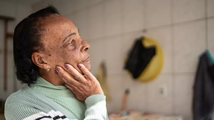 Older woman looking into the distance