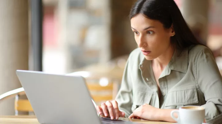 Woman looking at laptop