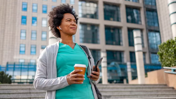 Woman walking with headphones in