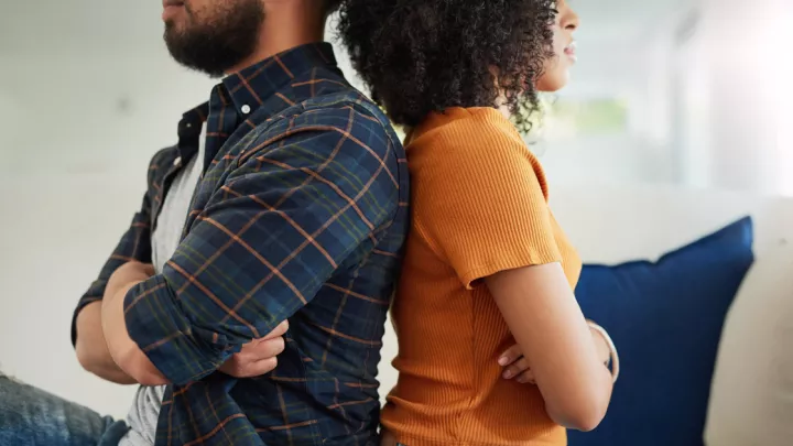 Man and woman sitting back to back